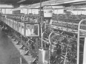 A rear view of a multi-head stocking machine